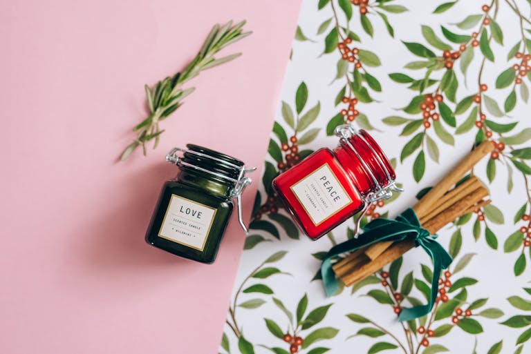 Aromatic scented candles and holiday decor create a warm and festive atmosphere.
